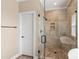 The bathroom features a glass enclosed shower with a tiled surround and niche at 115 Ladybug Ct, Statesville, NC 28625