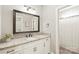 This bathroom features a granite countertop vanity and a framed mirror with black hardware at 115 Ladybug Ct, Statesville, NC 28625