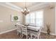 Formal dining room features hardwood floors, chandelier, and lots of natural light at 115 Ladybug Ct, Statesville, NC 28625