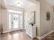 Welcoming entryway with hardwood floors and decorative accents at 115 Ladybug Ct, Statesville, NC 28625