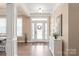 Bright entryway featuring hardwood floors and a decorative console table at 115 Ladybug Ct, Statesville, NC 28625