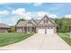 Beautiful brick home with a manicured lawn and a long driveway at 115 Ladybug Ct, Statesville, NC 28625