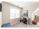 This home office features a desk, a chair, a lamp, and a window at 115 Ladybug Ct, Statesville, NC 28625
