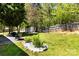 Spacious backyard features a storage shed, patio furniture, garden bed, and ample green space at 119 Sweet Martha Dr, Mooresville, NC 28115