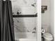 Bathroom featuring tiled walls, a bathtub, and modern fixtures at 119 Sweet Martha Dr, Mooresville, NC 28115