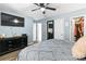 Bedroom with light blue walls, a ceiling fan, and a glimpse into the walk-in closet at 119 Sweet Martha Dr, Mooresville, NC 28115