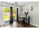 Bright dining area with patio access, modern decor, and a stylish table set for two at 119 Sweet Martha Dr, Mooresville, NC 28115