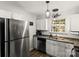 Modern kitchen with stainless steel appliances, a double sink, and white cabinetry at 119 Sweet Martha Dr, Mooresville, NC 28115