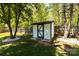 Backyard storage shed with black and white trim, offering ample space for outdoor equipment at 119 Sweet Martha Dr, Mooresville, NC 28115
