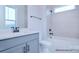 Modern bathroom featuring sleek vanity, white tiling, and contemporary fixtures with shower-tub combination at 122 Huntcliff Dr, Statesville, NC 28677