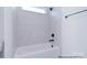 Modern tub-shower combo with white subway tile, black fixtures and natural lighting at 122 Huntcliff Dr, Statesville, NC 28677