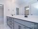 Spacious bathroom featuring double vanity with modern fixtures, large mirror, and tile flooring at 122 Huntcliff Dr, Statesville, NC 28677