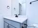 Elegant bathroom vanity with modern fixtures, a white countertop, and shaker style cabinets at 122 Huntcliff Dr, Statesville, NC 28677