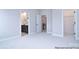 Spacious bedroom featuring soft carpet, ensuite bathroom, and walk-in closet with ample storage at 122 Huntcliff Dr, Statesville, NC 28677