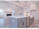 Gourmet kitchen with marble countertops, large island, stainless steel appliances, and open concept living space at 122 Huntcliff Dr, Statesville, NC 28677