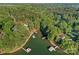 Beautiful aerial view showcasing the lake and houses nestled among the trees and private docks at 127 Holt Ln, Mooresville, NC 28117