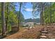Picturesque backyard with a stone path leading to a dock on the waterfront, perfect for nature lovers at 127 Holt Ln, Mooresville, NC 28117