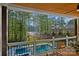 Outdoor living area with pool, lake view, and a spacious yard at 127 Holt Ln, Mooresville, NC 28117