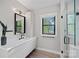 Modern bathroom with sleek fixtures, a spacious vanity, and a glass-enclosed shower at 127 Holt Ln, Mooresville, NC 28117
