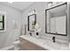 Stylish bathroom with a double sink vanity, modern fixtures, and a decorative flower arrangement at 127 Holt Ln, Mooresville, NC 28117