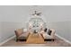 Expansive bedroom features hardwood floors, sitting area, ceiling fan, and natural light at 127 Holt Ln, Mooresville, NC 28117