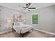 Inviting bedroom featuring a metal bed frame, neutral decor and ample natural light at 127 Holt Ln, Mooresville, NC 28117