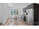 Bright breakfast nook boasts stainless steel appliances, modern cabinets, and natural light at 127 Holt Ln, Mooresville, NC 28117