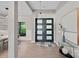 Elegant foyer with modern lighting, stylish front door, and chic decor, creating a welcoming entrance at 127 Holt Ln, Mooresville, NC 28117