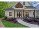 Charming home entrance with a well-manicured garden, stylish front door, and inviting curb appeal at 127 Holt Ln, Mooresville, NC 28117