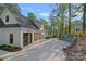 Spacious three-car garage with modern doors, long driveway, and well-maintained landscaping, offering ample parking at 127 Holt Ln, Mooresville, NC 28117
