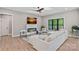 Elegant living room featuring a modern fireplace, comfortable seating, and large windows with green views at 127 Holt Ln, Mooresville, NC 28117