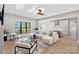 Contemporary living room with lake views, stylish furniture, and an open layout connecting to the kitchen at 127 Holt Ln, Mooresville, NC 28117