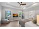 Spacious main bedroom with large windows, lake view, and a modern ceiling fan at 127 Holt Ln, Mooresville, NC 28117