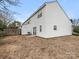 White vinyl-sided exterior showcasing a backyard and lawn space at 12954 Sickles Dr, Charlotte, NC 28273