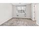A cozy bedroom featuring neutral carpeting and a large window at 12954 Sickles Dr, Charlotte, NC 28273