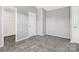 A cozy bedroom with neutral carpeting and trim at 12954 Sickles Dr, Charlotte, NC 28273