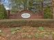 Charming neighborhood entrance sign with brickwork and manicured landscape at 12954 Sickles Dr, Charlotte, NC 28273
