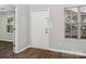 This entryway features attractive laminate floors, a large window, and a convenient coat closet at 12954 Sickles Dr, Charlotte, NC 28273