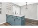 Stylish kitchen island with quartz countertop and black hardware accents at 12954 Sickles Dr, Charlotte, NC 28273