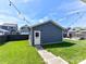 Charming backyard features a detached garage, creating an inviting outdoor space at 13702 Jacks Ln, Pineville, NC 28134