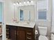Well-lit bathroom featuring double sinks, modern fixtures, and neutral decor at 13702 Jacks Ln, Pineville, NC 28134