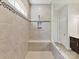 Contemporary bathroom highlighting the tiled shower with a built-in bench at 13702 Jacks Ln, Pineville, NC 28134