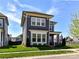Charming two-story home features a well-manicured lawn and a welcoming front porch with an American flag at 13702 Jacks Ln, Pineville, NC 28134