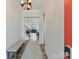 Bright foyer featuring hardwood floors, a bench, and a clear view into the living areas and staircase at 13702 Jacks Ln, Pineville, NC 28134