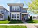 Charming two-story home with a red front door, well-maintained lawn, and an American flag at 13702 Jacks Ln, Pineville, NC 28134
