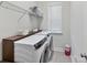 Bright laundry room features modern appliances, ample counter space, and stylish storage at 13702 Jacks Ln, Pineville, NC 28134