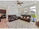 Comfortable living room featuring leather couches, bright windows, and an inviting atmosphere at 13702 Jacks Ln, Pineville, NC 28134
