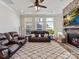 Comfortable living room featuring leather couches, a stone fireplace, and an inviting atmosphere at 13702 Jacks Ln, Pineville, NC 28134