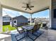 Covered patio has a cozy outdoor dining set, seamlessly blending indoor and outdoor living at 13702 Jacks Ln, Pineville, NC 28134