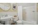 Well-lit bathroom featuring a classic white sink, toilet, and bathtub-shower combination, creating a clean and functional space at 13916 & 13912 Sledge Rd, Charlotte, NC 28278